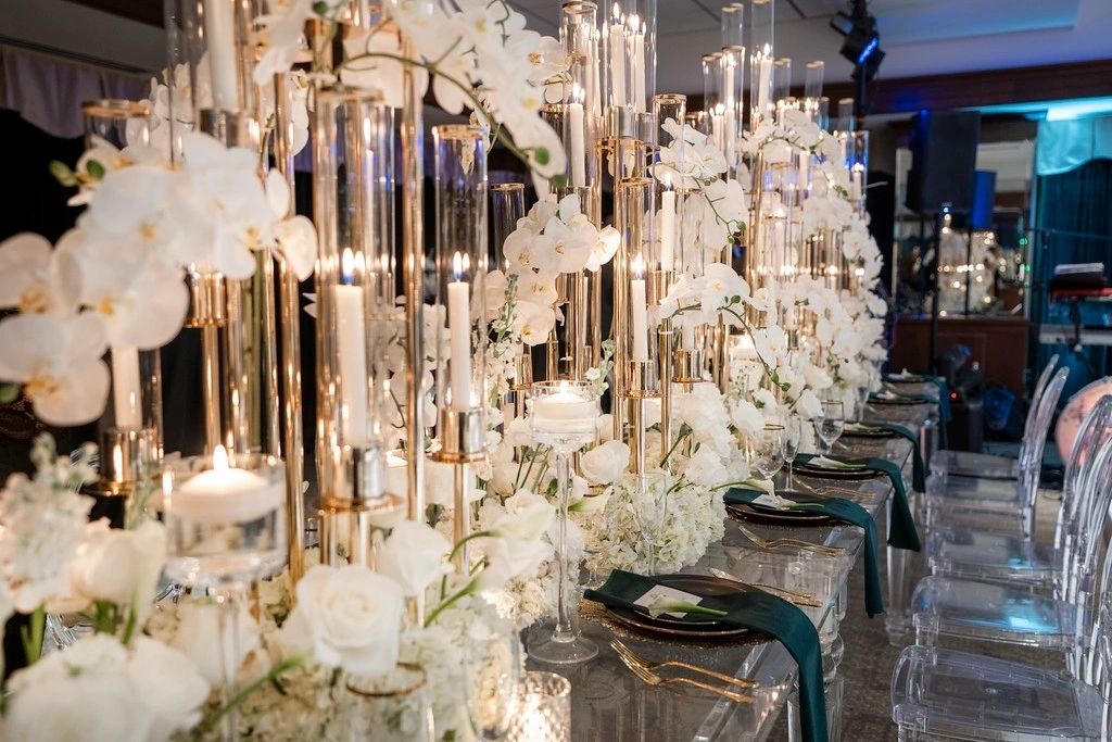 A long table with many candles and flowers